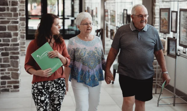 Couple lead by Menno Haven tour guide