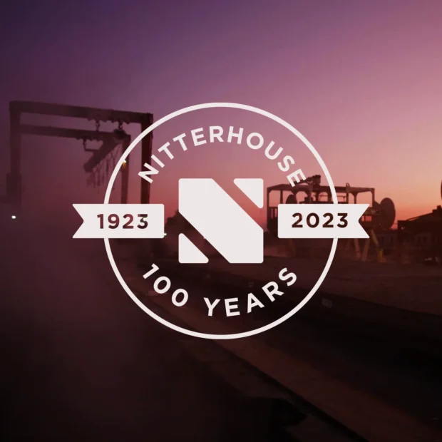 Nitterhouse Concrete 100 year logo over sunset background