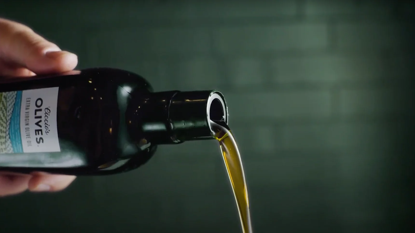 pouring olive oil from the bottle