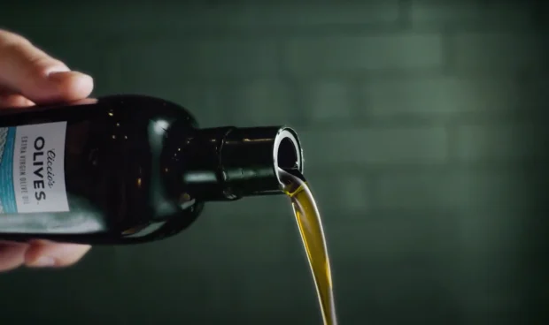pouring olive oil from the bottle