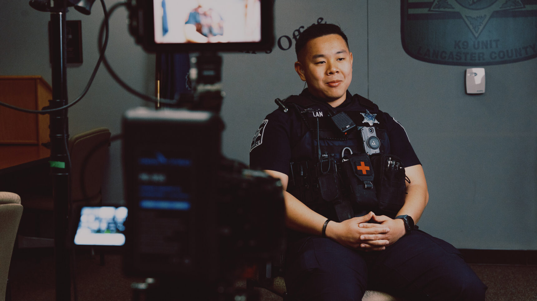 Officer sitting in front of camera
