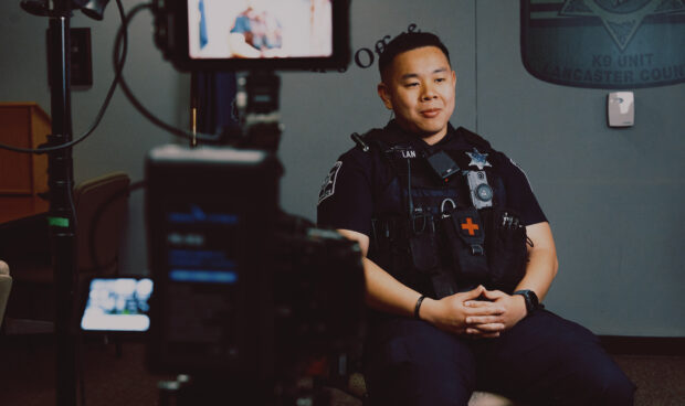 Officer sitting in front of camera