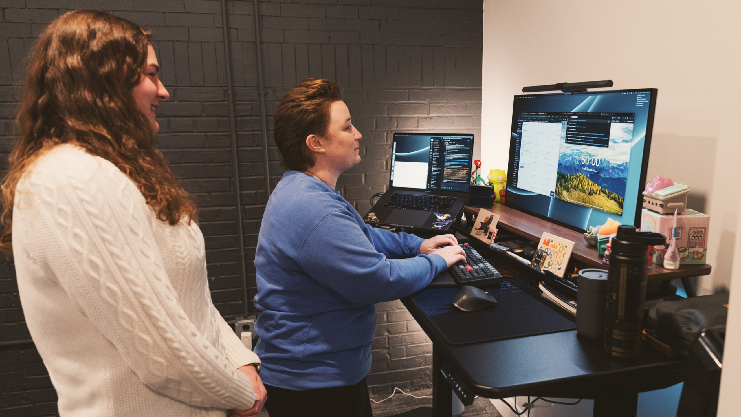 2 females looking at screen for web design