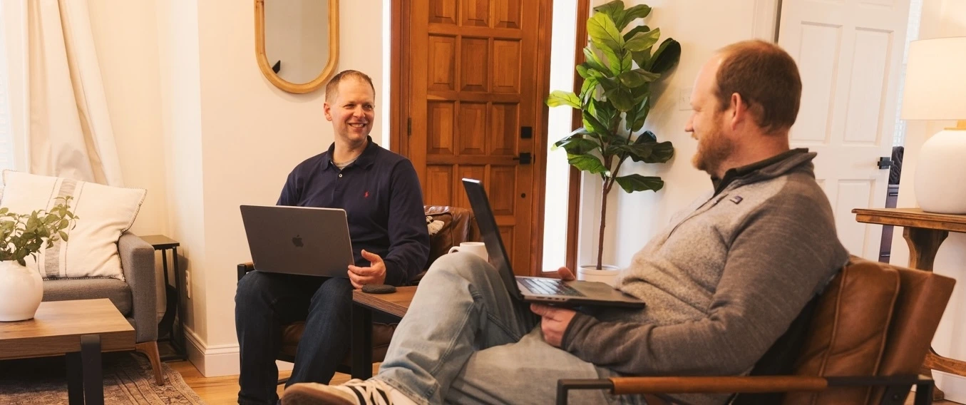 Cross & Crown employees sitting on chairs and talking
